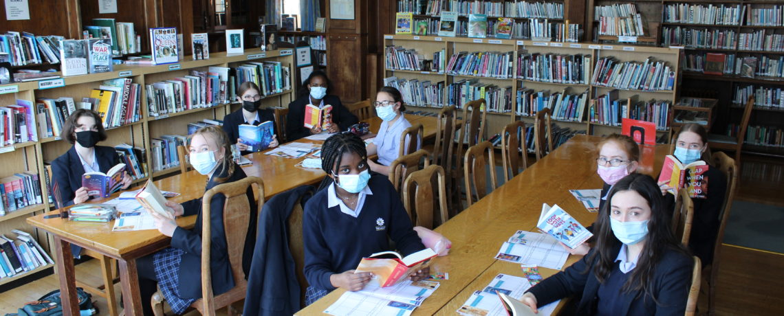 Year 9 girls read in The Mount's beautiful library